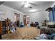 Spacious living room featuring a ceiling fan and access to other rooms at 5709 Breskin Dr, Orlando, FL 32839