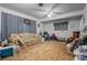 Living room with vintage floral couch, side tables, and basic décor at 5709 Breskin Dr, Orlando, FL 32839