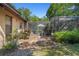 A side view of the home shows the pool enclosure and backyard at 5709 Breskin Dr, Orlando, FL 32839