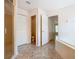This bathroom features tile flooring, a glass door shower, and multiple doors at 602 Milan Dr, Kissimmee, FL 34758