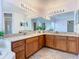 Spacious primary bathroom with dual sinks, large mirrors, and ample cabinet storage for a convenient routine at 602 Milan Dr, Kissimmee, FL 34758