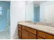 Bathroom with updated vanity featuring granite countertops and a view into shower/toilet room at 602 Milan Dr, Kissimmee, FL 34758