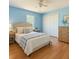 Cozy bedroom featuring a ceiling fan, closet, and natural light from the window at 602 Milan Dr, Kissimmee, FL 34758