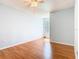Empty bedroom features a ceiling fan and a large window with natural light at 602 Milan Dr, Kissimmee, FL 34758