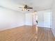 Spacious bedroom with a ceiling fan and wood floors, offering a versatile space for relaxation at 602 Milan Dr, Kissimmee, FL 34758