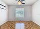 This room features a window and geometric tile flooring at 602 Milan Dr, Kissimmee, FL 34758