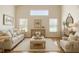 Bright living room featuring comfortable seating, stylish decor, and large windows for natural light at 602 Milan Dr, Kissimmee, FL 34758