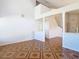 Spacious living room area with high ceilings, star-patterned flooring, and stairway access at 602 Milan Dr, Kissimmee, FL 34758