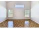 Bright living room featuring high ceilings, tile flooring, and natural light from multiple windows at 602 Milan Dr, Kissimmee, FL 34758