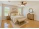 Calm main bedroom with a king bed, ceiling fan and plenty of natural light creating a relaxing retreat at 602 Milan Dr, Kissimmee, FL 34758