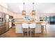 Stylish kitchen featuring a central island with seating, modern appliances, and an open layout for easy entertaining at 659 N Endeavour Dr, Winter Springs, FL 32708