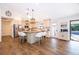 Modern kitchen with an island, stainless steel appliances, pendant lighting, and a seamless connection to the outdoors at 659 N Endeavour Dr, Winter Springs, FL 32708