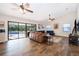 Open-concept living room with seamless access to a patio with a pool, ideal for indoor-outdoor living at 659 N Endeavour Dr, Winter Springs, FL 32708