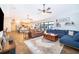 Spacious living room with modern furnishings, decorative shelving, and sliding glass doors that lead to an outdoor area at 659 N Endeavour Dr, Winter Springs, FL 32708