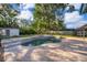 Backyard features a beautiful pool with brick paver decking and mature landscaping at 659 N Endeavour Dr, Winter Springs, FL 32708