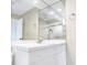 Bathroom with white sink and vanity beneath a mirrored wall with a silver faucet and towel holder at 7484 Canford Ct # 8, Winter Park, FL 32792
