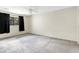 Spacious bedroom with large window and carpet flooring, providing ample natural light at 7484 Canford Ct # 8, Winter Park, FL 32792