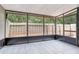 Enclosed lanai featuring tiled flooring and screened windows, offering a serene outdoor space at 7484 Canford Ct # 8, Winter Park, FL 32792