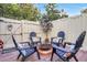 Inviting brick patio with Adirondack chairs arranged around a fire pit at 7484 Canford Ct # 8, Winter Park, FL 32792