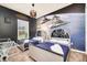 Themed bedroom with two twin beds, unique space-themed headboards and a Star Wars mural at 7587 Sunflower Cir, Kissimmee, FL 34747