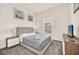 Inviting bedroom with neutral tones, featuring plush bedding, artwork, and a relaxing atmosphere at 7587 Sunflower Cir, Kissimmee, FL 34747