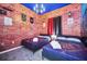 Themed bedroom featuring two beds, a brick-style wall, and decorative accents creating a playful ambiance at 7587 Sunflower Cir, Kissimmee, FL 34747