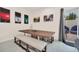Dining room with wooden table, bench seating, and access to the outdoor patio at 7587 Sunflower Cir, Kissimmee, FL 34747