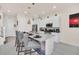 Bright kitchen with stainless steel appliances and a granite-topped island with seating at 7587 Sunflower Cir, Kissimmee, FL 34747
