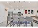 Bright kitchen with granite countertops, stainless steel appliances, and modern lighting at 7587 Sunflower Cir, Kissimmee, FL 34747
