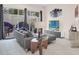 Stylish living room with a gray sectional, contemporary decor, and patio access at 7587 Sunflower Cir, Kissimmee, FL 34747