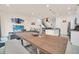 Bright open-concept living space featuring a dining area, modern kitchen, and comfortable seating arrangement at 7587 Sunflower Cir, Kissimmee, FL 34747