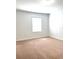 Bedroom with neutral carpet flooring and a window at 7675 Fordson Ln, Windermere, FL 34786