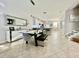 Modern dining area featuring a glass-top table, elegant seating, and stylish decor at 7675 Fordson Ln, Windermere, FL 34786