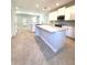 Open-concept kitchen featuring a large island, modern appliances, and plenty of cabinet space at 7675 Fordson Ln, Windermere, FL 34786