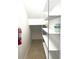 A walk-in pantry featuring wire shelving and tile flooring; also includes a fire extinguisher for added safety at 7675 Fordson Ln, Windermere, FL 34786