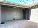 Spacious backyard patio is covered with brick pavers and strung with cafe lights at 7675 Fordson Ln, Windermere, FL 34786