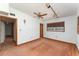 Bedroom with a ceiling fan, track lighting, and a window overlooking greenery at 770 Manor Dr, Bartow, FL 33830
