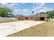 Charming brick home featuring a long driveway and well-kept lawn at 770 Manor Dr, Bartow, FL 33830