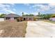 Charming brick home featuring a long driveway and covered parking at 770 Manor Dr, Bartow, FL 33830