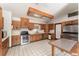 Traditional kitchen featuring wood cabinetry, and stainless-steel appliances at 770 Manor Dr, Bartow, FL 33830