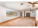 Spacious living room with large windows, plush carpet, and ample natural light at 770 Manor Dr, Bartow, FL 33830
