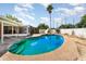 Backyard pool with slide, concrete deck and fenced in yard at 770 Manor Dr, Bartow, FL 33830