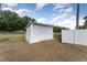 Backyard shed featuring vinyl siding and a fenced in yard at 770 Manor Dr, Bartow, FL 33830
