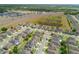 This aerial shot displays a highway, a wetland area, and a well-organized community at 902 Grand Hilltop Dr, Apopka, FL 32703