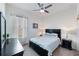 Nice bedroom with neutral paint, dark furniture, and bright windows at 902 Grand Hilltop Dr, Apopka, FL 32703
