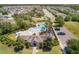 Aerial view of a community pool, playground, and clubhouse in a residential neighborhood at 902 Grand Hilltop Dr, Apopka, FL 32703