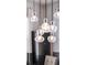 Close-up of a modern chandelier with elegant glass pendants, adding a touch of sophistication at 902 Grand Hilltop Dr, Apopka, FL 32703