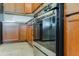 Stainless steel oven and refrigerator provide a modern touch, enhanced by the ample counter space of the kitchen at 902 Grand Hilltop Dr, Apopka, FL 32703