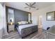 Main bedroom boasting a decorative headboard and light-colored wood floors, adding a relaxing ambiance to the space at 902 Grand Hilltop Dr, Apopka, FL 32703