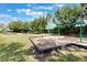 A community playground on a sunny day offers swings, slides, and a safe, fun environment for  at 902 Grand Hilltop Dr, Apopka, FL 32703